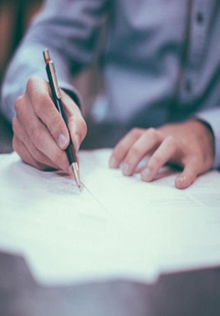 person writing with luxury pen